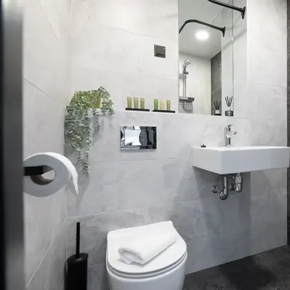 a bathroom with a sink and mirror