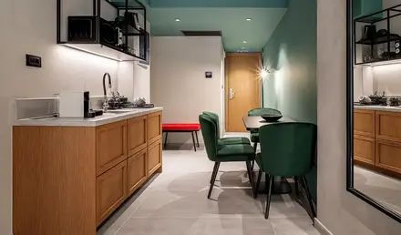 a kitchen with a table and chairs
