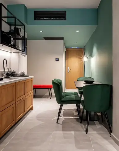 a kitchen with a table and chairs