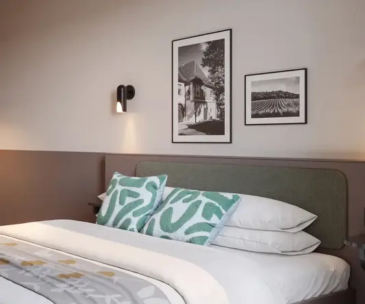 a bed with a table and chairs