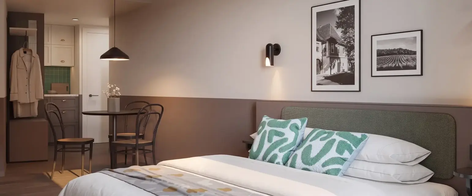 a bed with a table and chairs