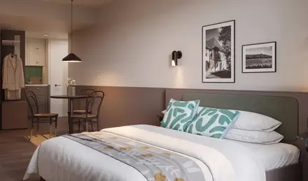 a bed with a table and chairs