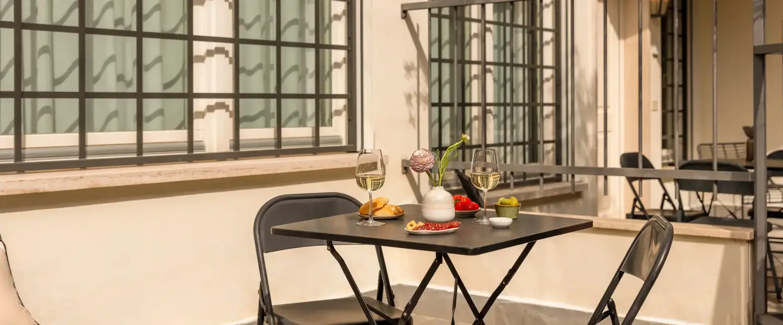 a table and chairs on a patio