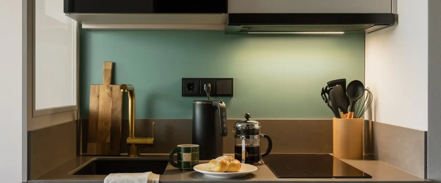 a kitchen with a microwave and a plate of food
