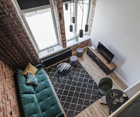 a living room with a couch and a rug