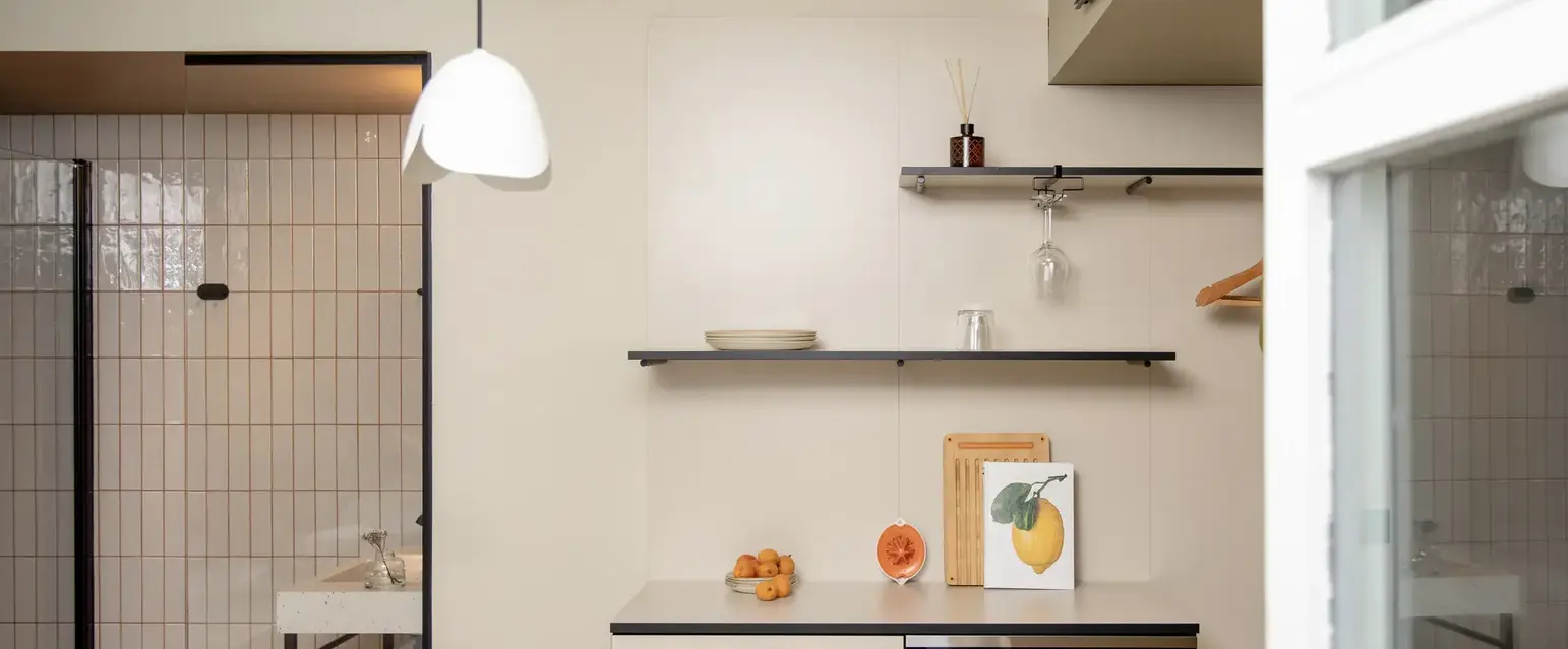 a kitchen with a table and a microwave