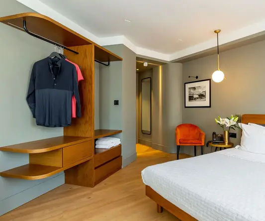 a bedroom with a bed and a closet