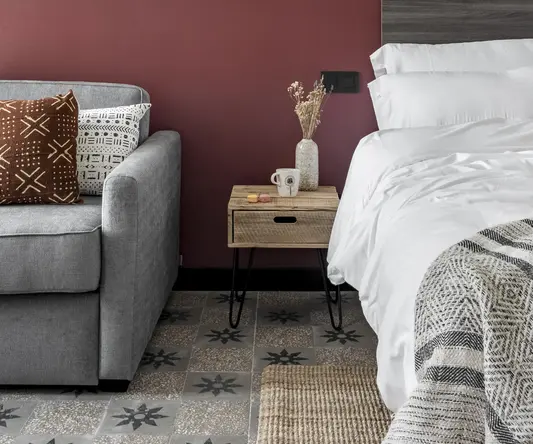 a bed and couch in a room