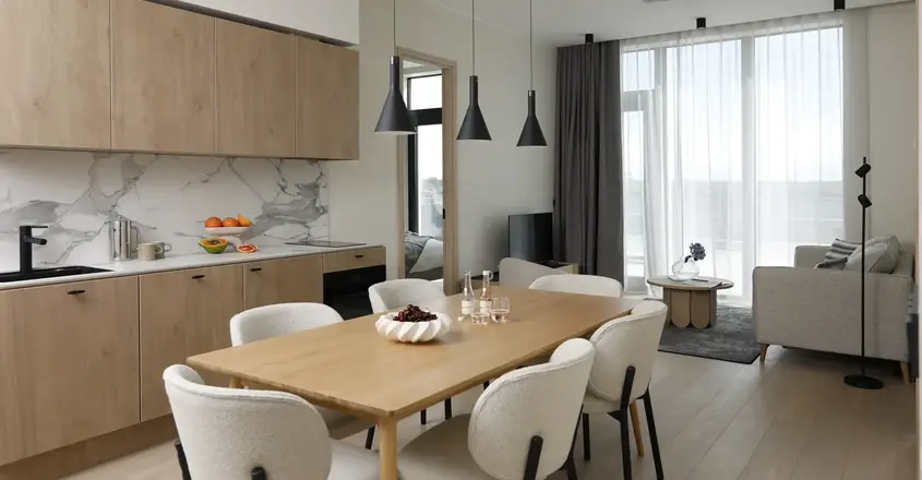 a dining room with a table and chairs