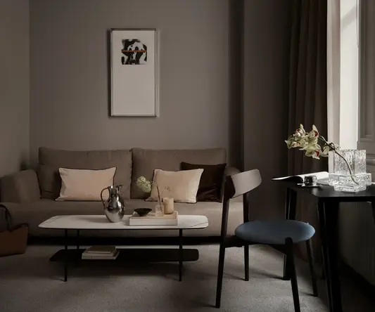 a living room with a couch and coffee table