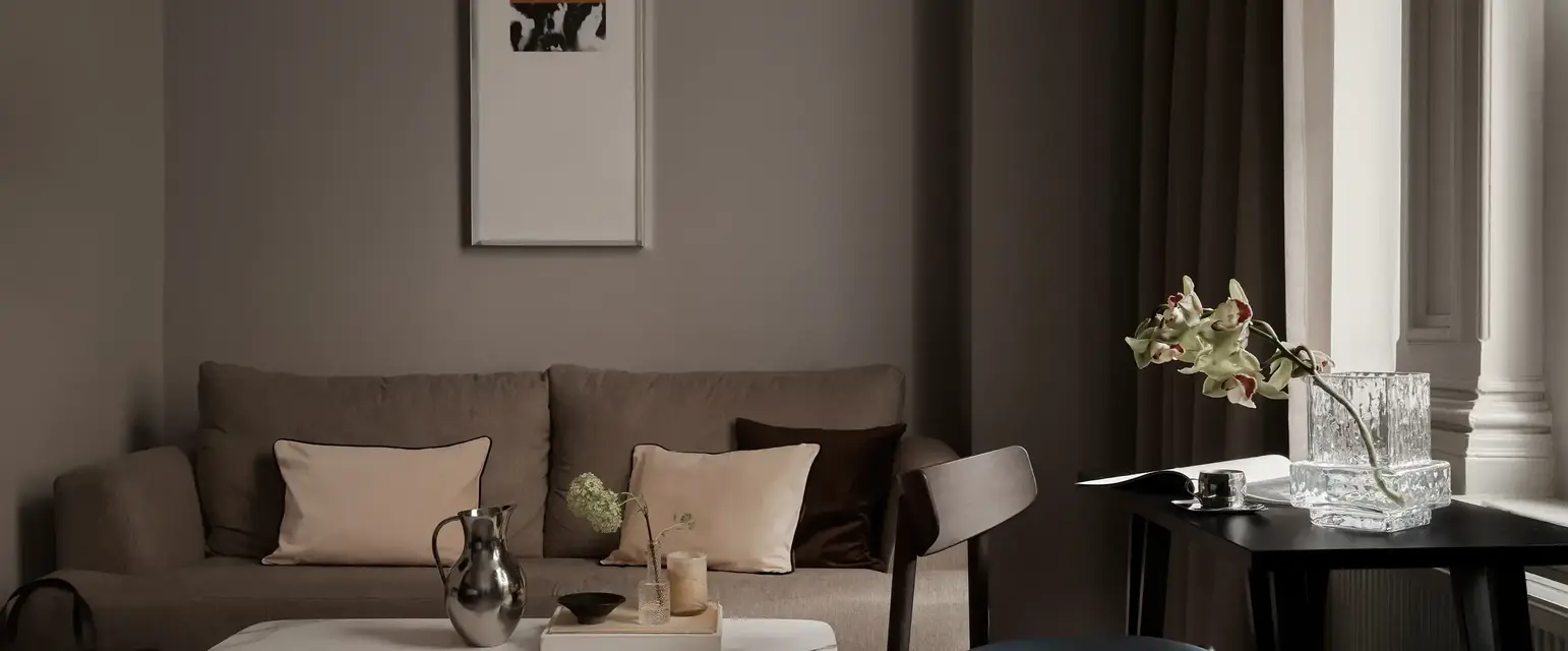 a living room with a couch and coffee table