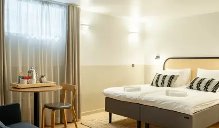 a room with a bed and a table