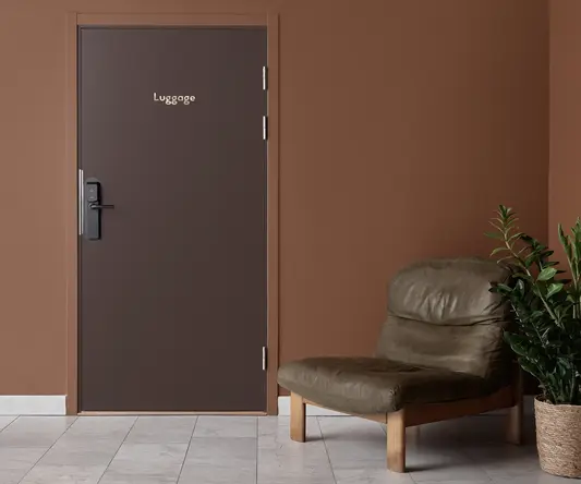 a brown door with a brown chair in front of it