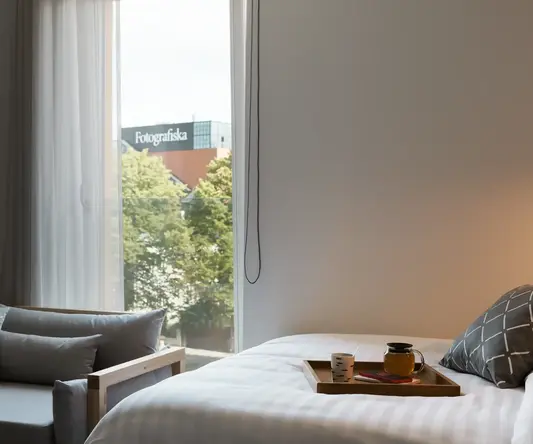 a bed with a tray of food on it