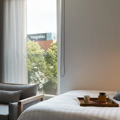 a bed with a tray of food on it