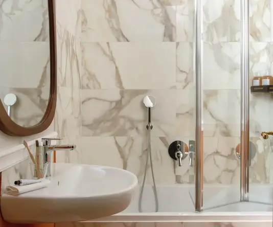 a bathroom with a shower and sink