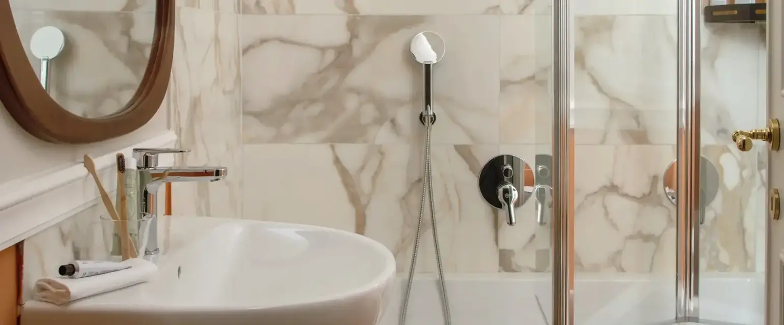 a bathroom with a shower and sink