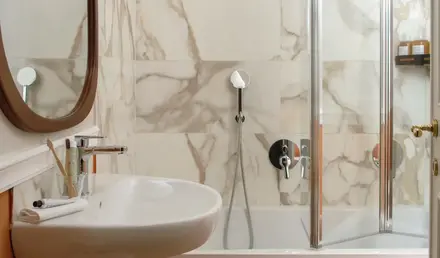 a bathroom with a shower and sink