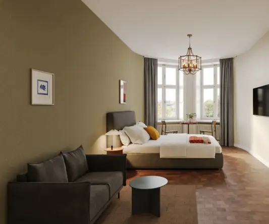 a bedroom with a bed and a couch