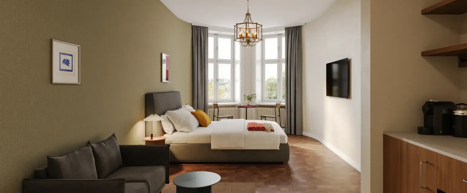 a bedroom with a bed and a couch