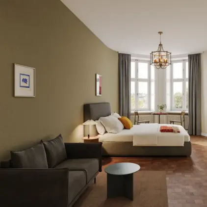 a bedroom with a bed and a couch