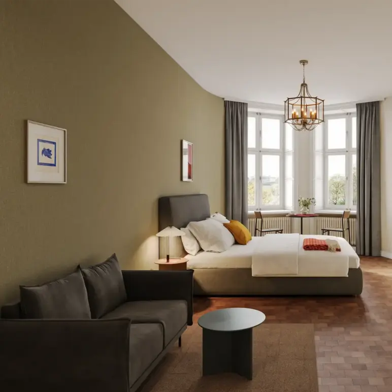 a bedroom with a bed and a couch