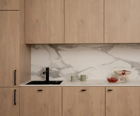 a kitchen with wood cabinets and a sink