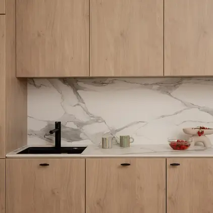 a kitchen with wood cabinets and a sink