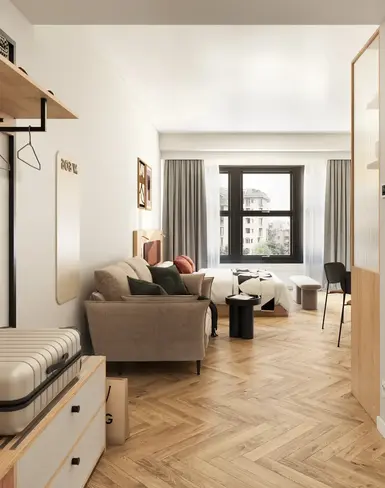 a room with a couch and a suitcase
