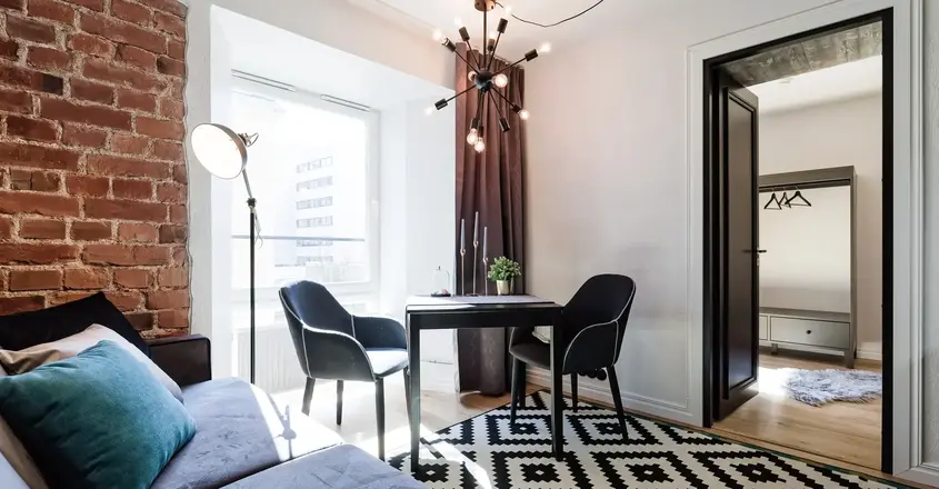 a living room with a couch and a table