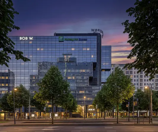 a building with trees in front of it