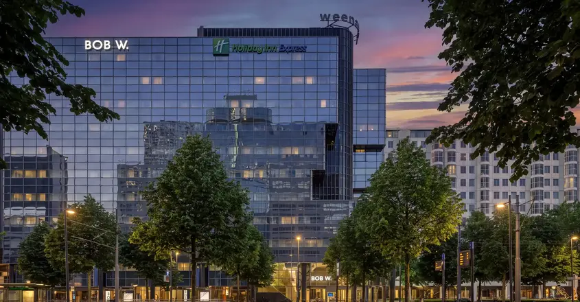 a building with trees in front of it