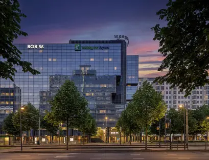 a building with trees in front of it