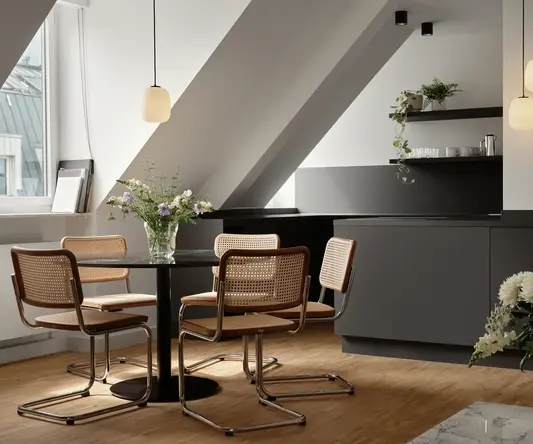 a room with a table and chairs