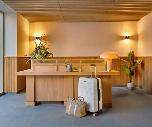 a luggage on a desk in a hotel lobby