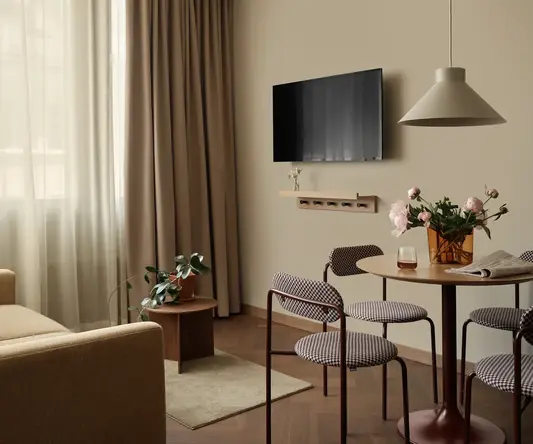 a living room with a tv on the wall