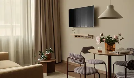 a living room with a tv on the wall