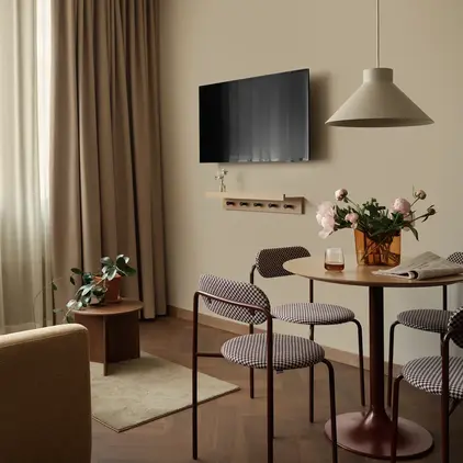 a living room with a tv on the wall