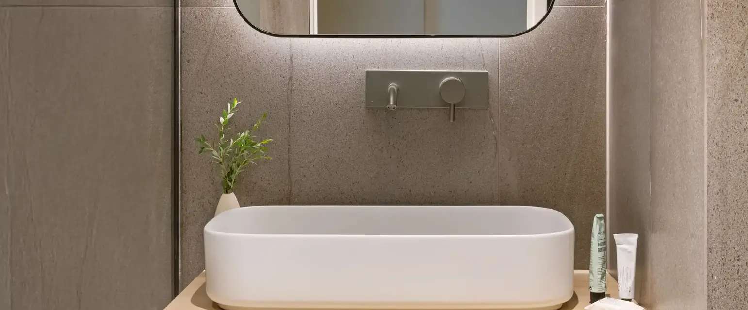 a sink and mirror in a bathroom