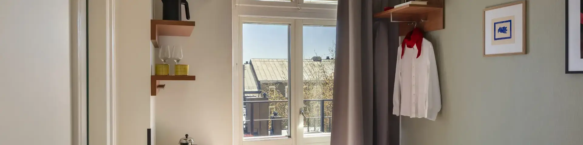 a room with a bed and a television