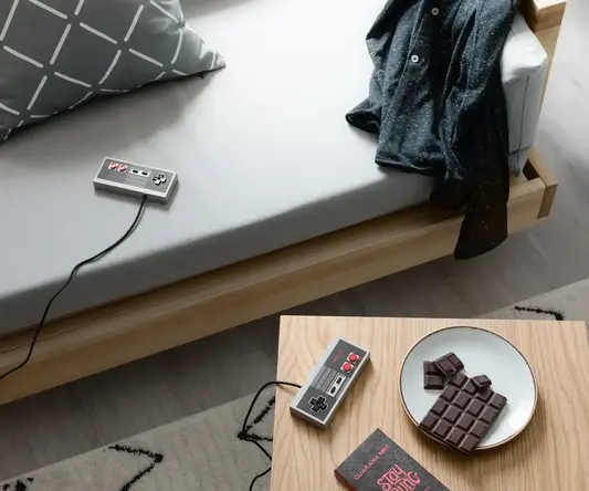 a video game console and chocolate on a table
