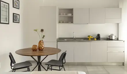 a kitchen with a table and chairs