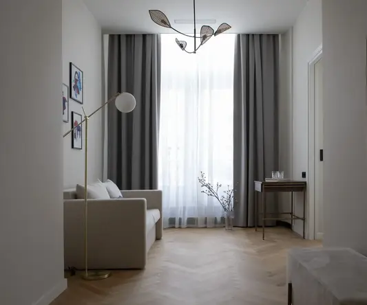 a room with a couch and a lamp