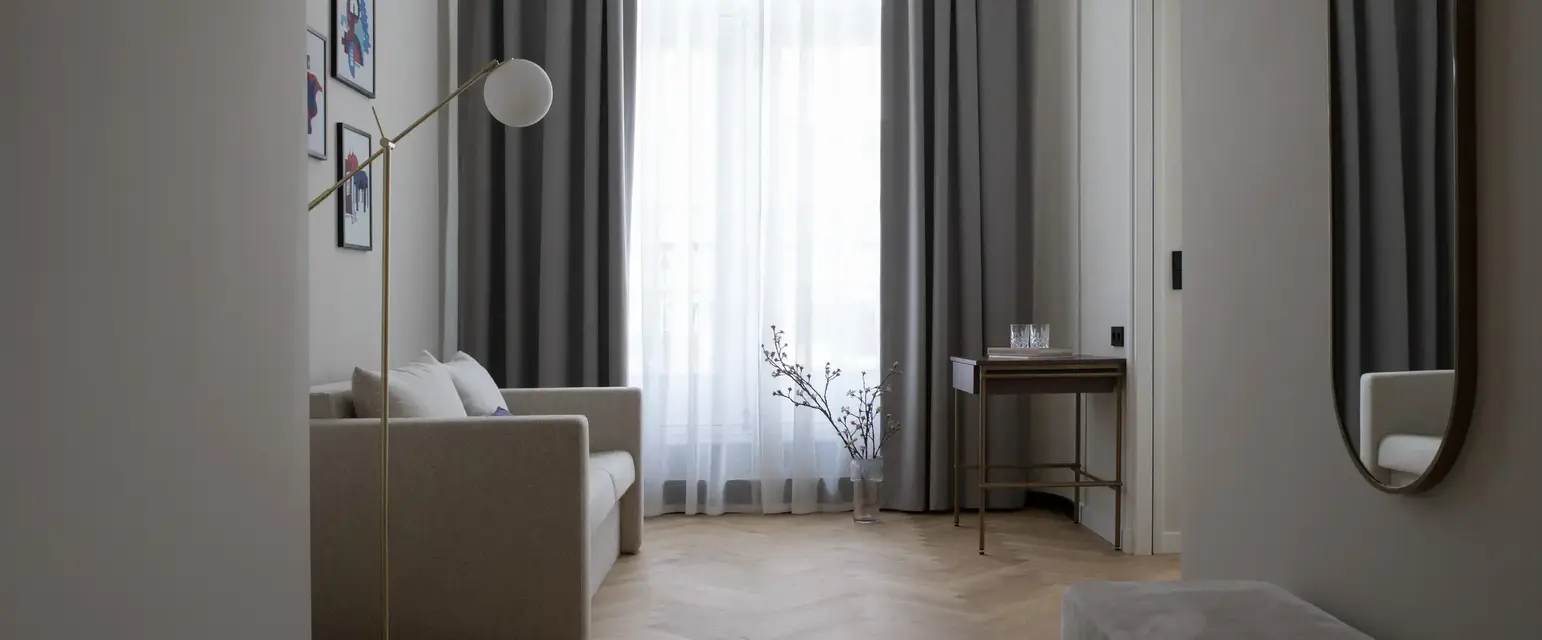 a room with a couch and a lamp