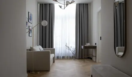 a room with a couch and a lamp