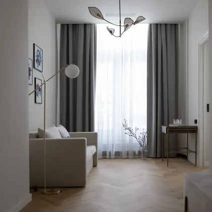 a room with a couch and a lamp