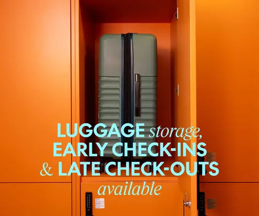 a green suitcase in an orange locker