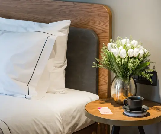 a white pillow on a bed