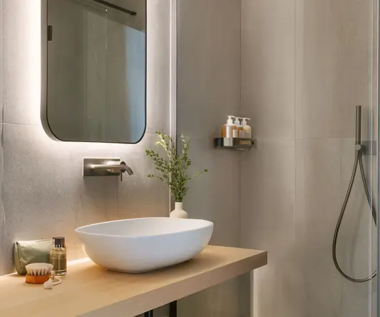 a bathroom with a sink and shower