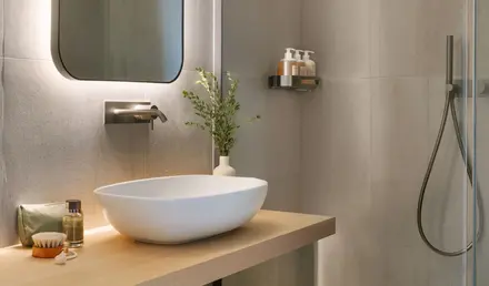 a bathroom with a sink and shower
